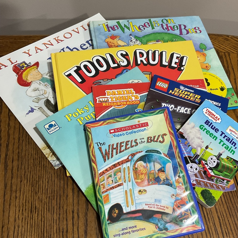 Books: Wheels on Bus, Tools Rule, I Grow Up, Daniel Tiger, Lego Superhero, Poky